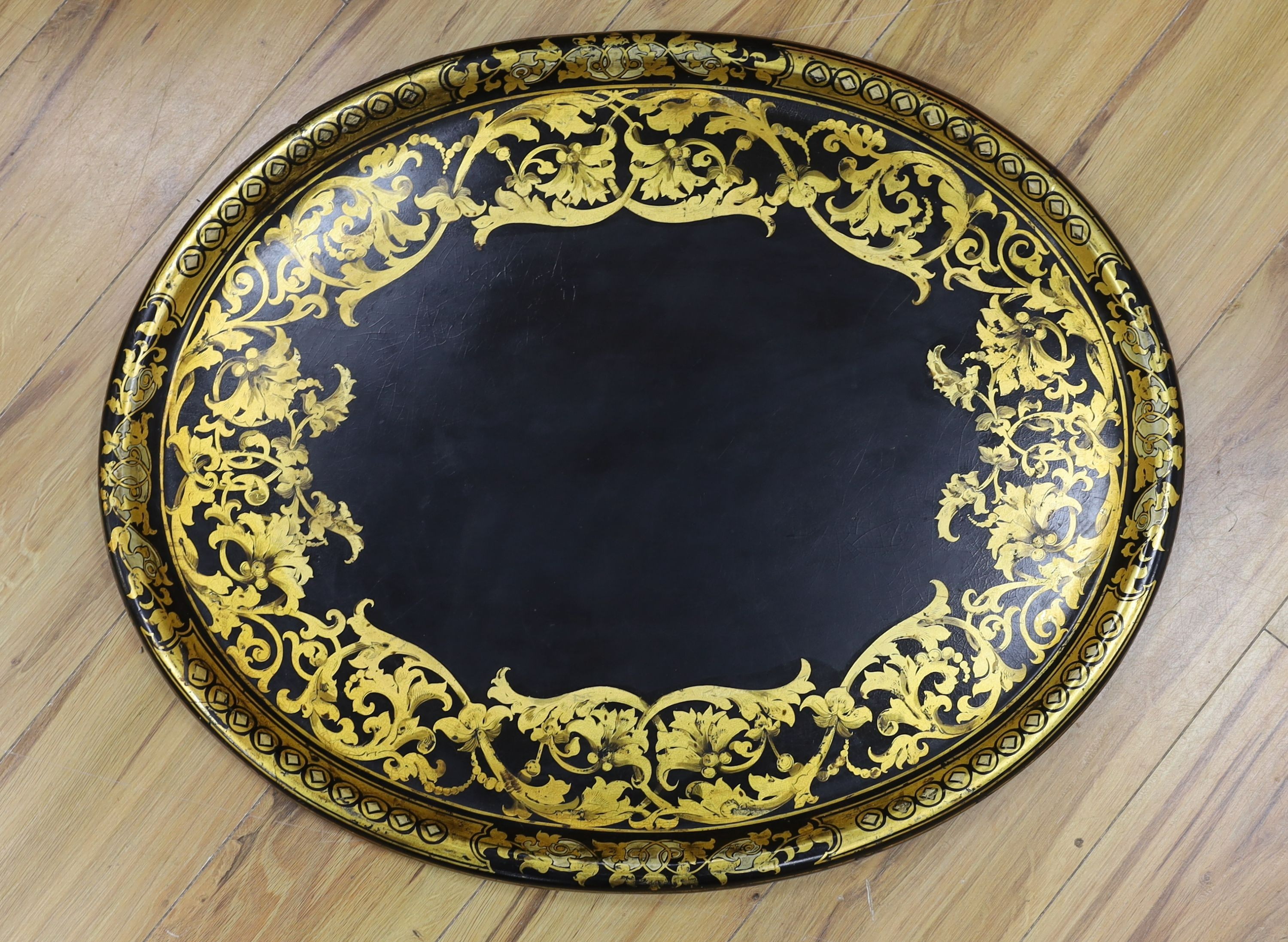 A large Victorian oval papier mache tray, 66cms wide.
